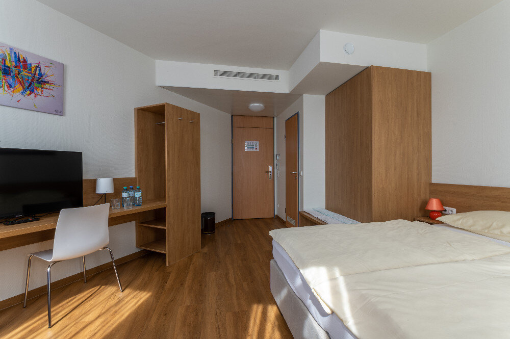 Bright room with bed and desk